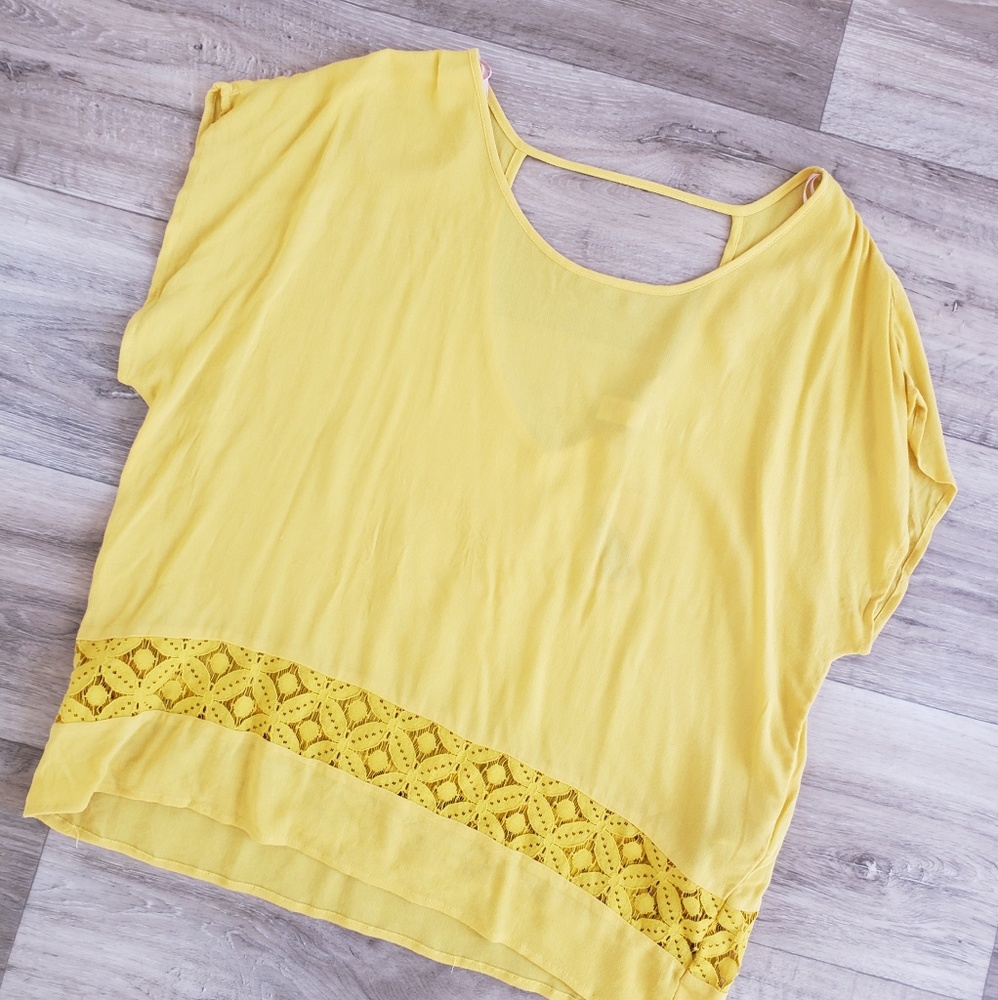 Yellow blouse with v cut back and lace hem